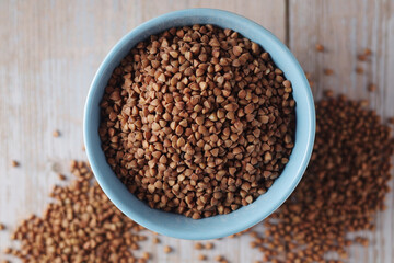 Buckwheat grain in a small ceramic bowl	