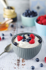 A bowl with Greek yogurt with berries	