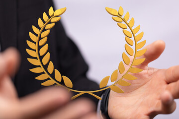 winner honer prize in hand