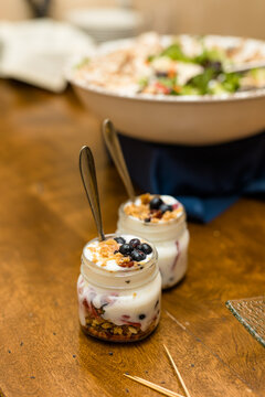 Individual Fancy Fruit Yogurt Parfaits With Granola And Fruit In Glass Jars, To Go, Take Out