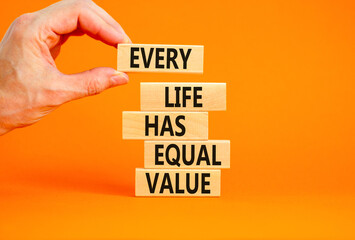 Every life has equal value symbol. Concept words Every life has equal value on wooden blocks. Businessman hand. Beautiful orange background. Business and every life has equal value concept. Copy space