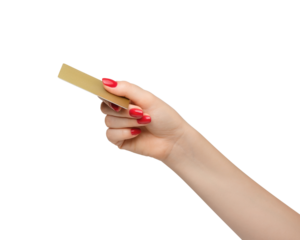 Plastic gold credit card in a woman's hand, red nail polish