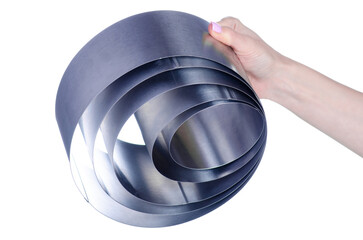 Metal round dishes for baking cake in hand on white background isolation