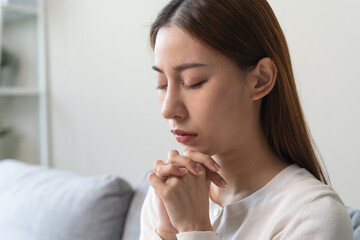 Christian woman praying for god blessing.