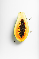 Half of ripe papaya fruit with seeds.