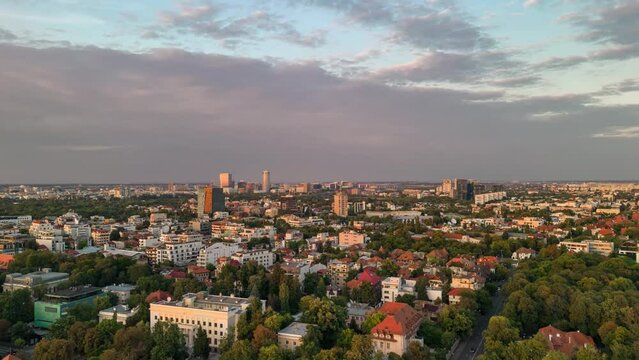 Hyperlapse of Bucharest city skyline at sunset aerial view Romania