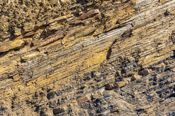 background, texture of layered brown rock