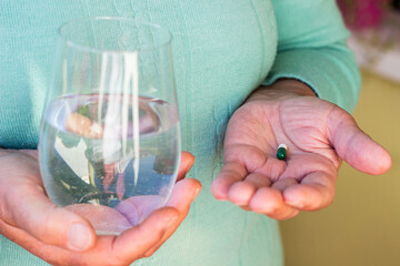 Senior woman taking a pills