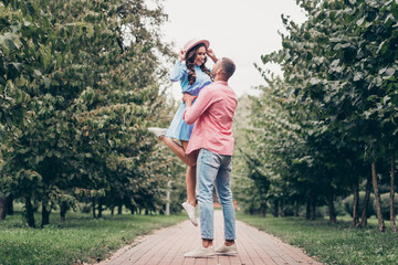 Obraz premium Photo of sweet excited two people together wear casual outfits holding arms dancing outside garden