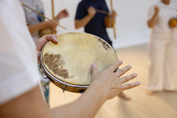 Capoeirsta Playing Pandeiro  in a Capoeira Roda