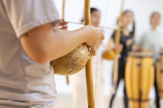 Capoeirsta Playing Berimbau in a Capoeira Roda
