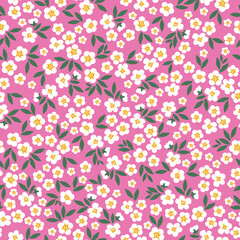 seamless vintage pattern. small white flowers and green leaves. pink background. vector texture. fashionable print for textiles and wallpaper.