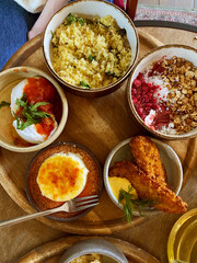 Brunch table setting with different delicious food indoors, top view