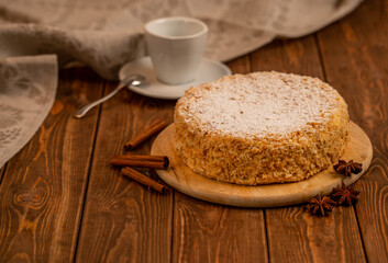 Classic napoleon cake on a wooden table. Home cake