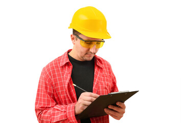 Portrait of a male builder in a helmet signing a contract on a white background. Construction, development, teamwork