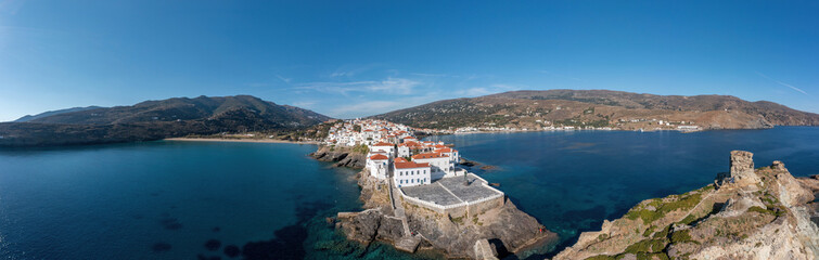 Andros Island, Greece. Chora town aerial panorama. Traditional buildings on cape.