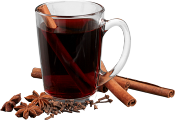 Hot red mulled wine isolated on white background with Christmas spices close up.