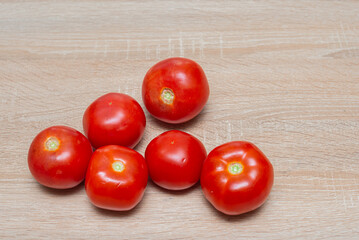 Fresh tomatoes on a wooden table