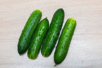 Fresh cucumbers on a wooden table