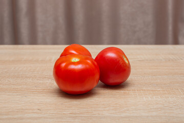 Fresh tomatoes on a wooden table