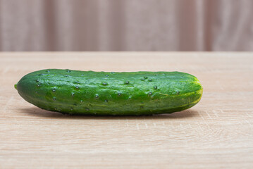 Fresh cucumbers on a wooden table