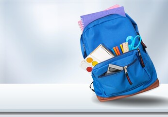 Classic colored school backpack with supplies