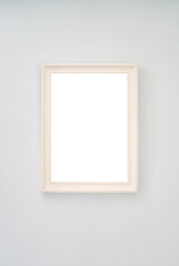 Beige empty photo frame hanging on the wall. High quality photo