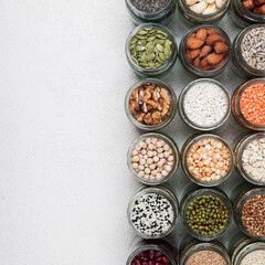 Obraz na płótnie Canvas Vegan source of protein. healthy vegetarian food. top view of seeds, nuts, peas, beans, spelt, oatmeal on white background copy space square