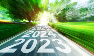 New year 2023 to 2026 written on highway with blurred motion