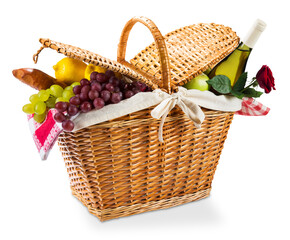 Wicker picnic basket with a red gingham cloth on a white background