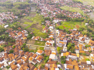 Abstract Defocused Blurred Background Aerial Cikancung area which is densely populated with houses and surrounded by rice fields. Not Focus