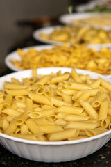penne in a restaurant with a variety of italian pasta options