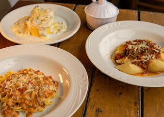 dishes with different italian pasta and types of sauce