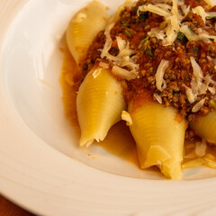 Italian pasta conchiglione with bolognese sauce