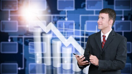 Business finance graph and young businessman posing