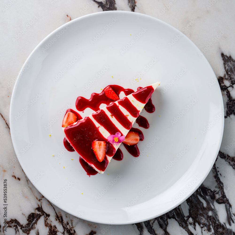 Sticker cheesecake with strawberries on plate