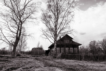 Obraz premium abandoned village in the outback of poor Russia, black and white photo