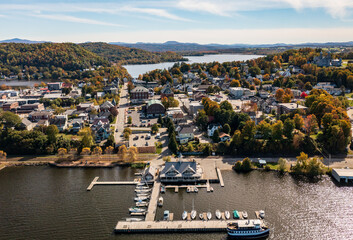 Aerial view of the city of Newport in Vermont from above the lake with autumn colors and leaves - obrazy, fototapety, plakaty