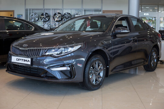 Russia, Izhevsk - July 4, 2019: New cars in the KIA showroom. Modern car business class Optima. Famous world brand.