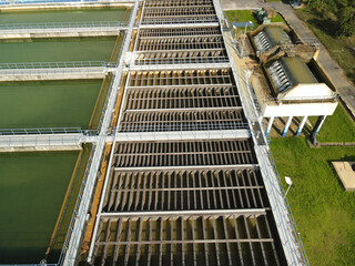 Water treatment facility with several filtration pools. Aerial drone view