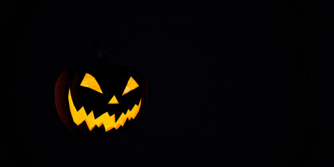 Halloween pumpkin with scary face on black background, 3d render, logo