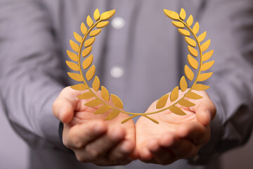 winner honer prize in hand