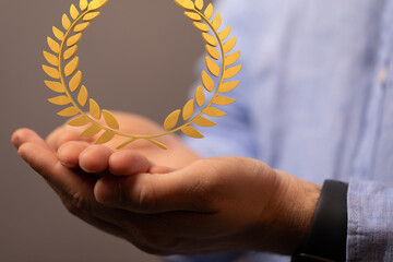 winner honer prize in hand