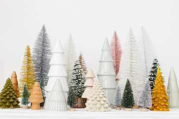 Merry Christmas and Happy Holidays! Stylish little Christmas trees on white background. Festive...