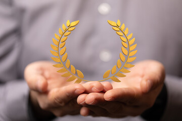 winner honer prize in hand