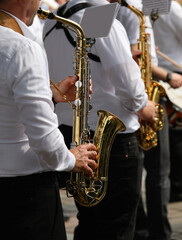 saxophonists of the musical band during the singing event