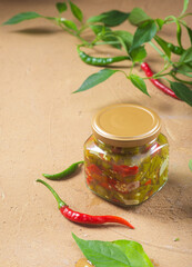 Pickled red and green hot peppers