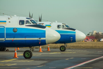 Propeller-driven Soviet aircraft stand close-up in the parking lot at the airport against the...