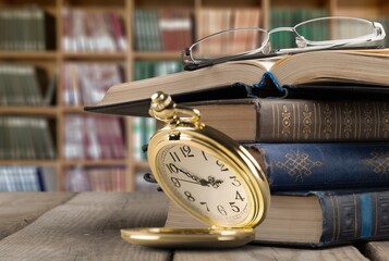 Retro golden pocket Watch and Old Book