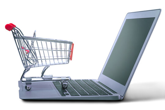 Laptop and shopping cart on white background